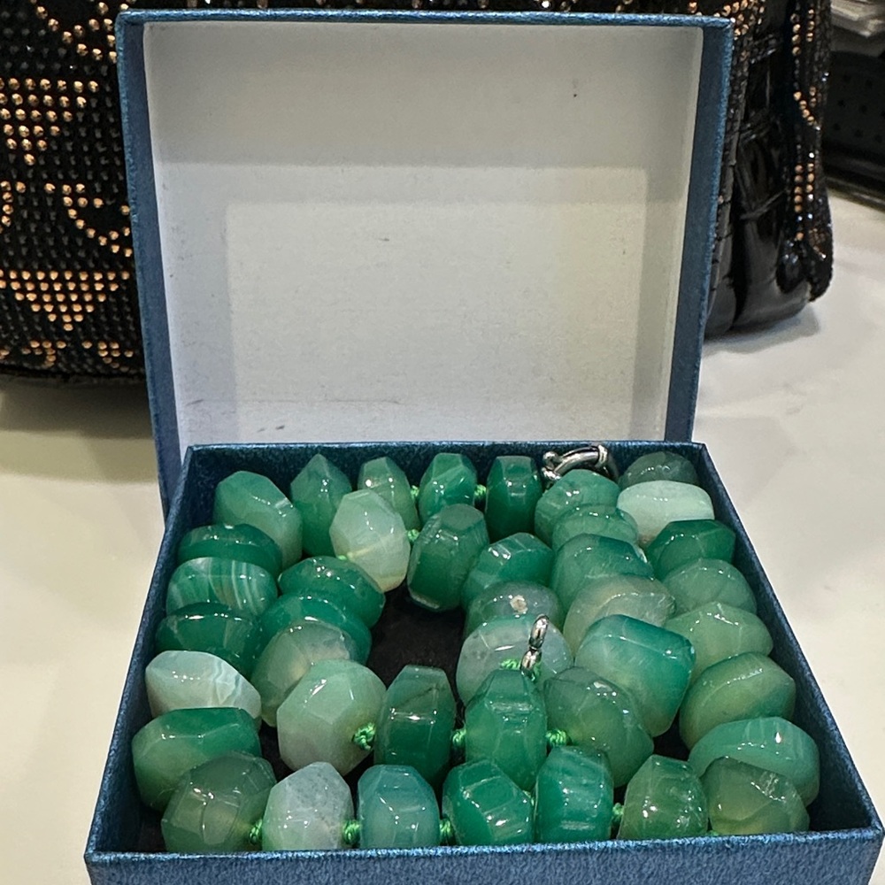 This is a green aventurine or green onyx faceted bead necklace